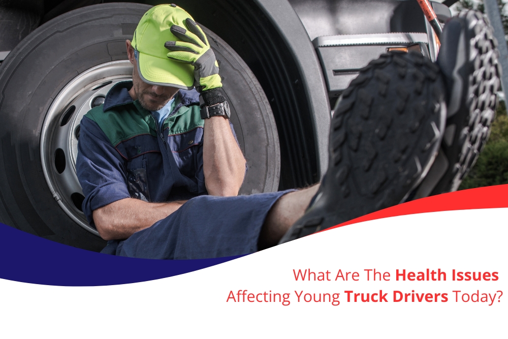 A young truck driver sitting exhausted against a large truck tire, wearing a high-visibility cap and gloves. The image highlights the health issues faced by young truck drivers today, including physical and mental fatigue. Text overlay reads: 'What Are The Health Issues Affecting Young Truck Drivers Today?'