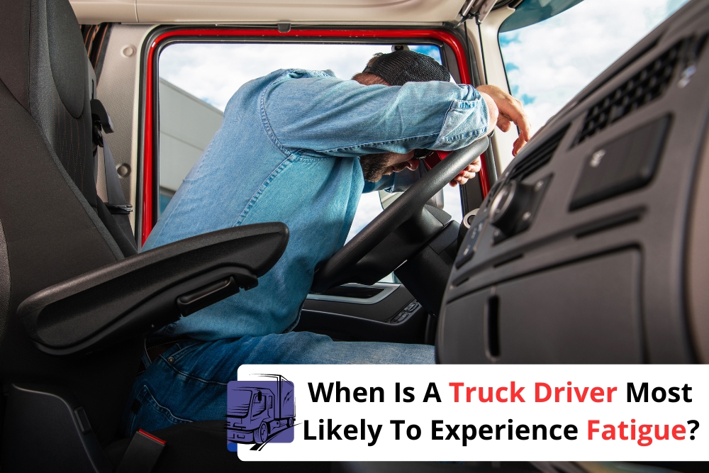 Truck driver fatigue: A truck driver leans on the steering wheel inside a parked truck, visibly exhausted.