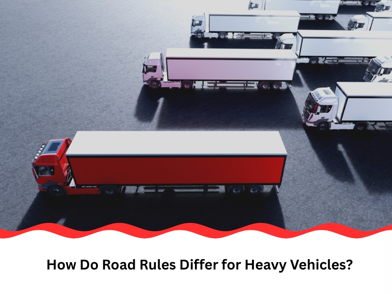 A red heavy vehicle stands out amongst white trucks, illustrating the concept of different heavy vehicle road rules in Australia.